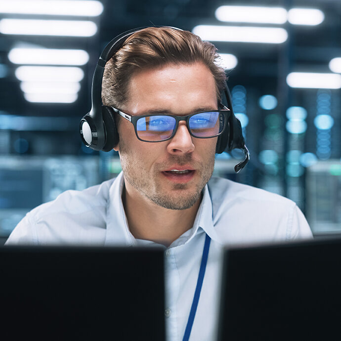 Portrait of a Young Caucasian Male Call Centre Worker Wearing a